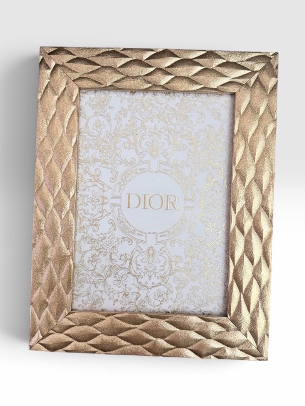 Dior gold accent photo in frame